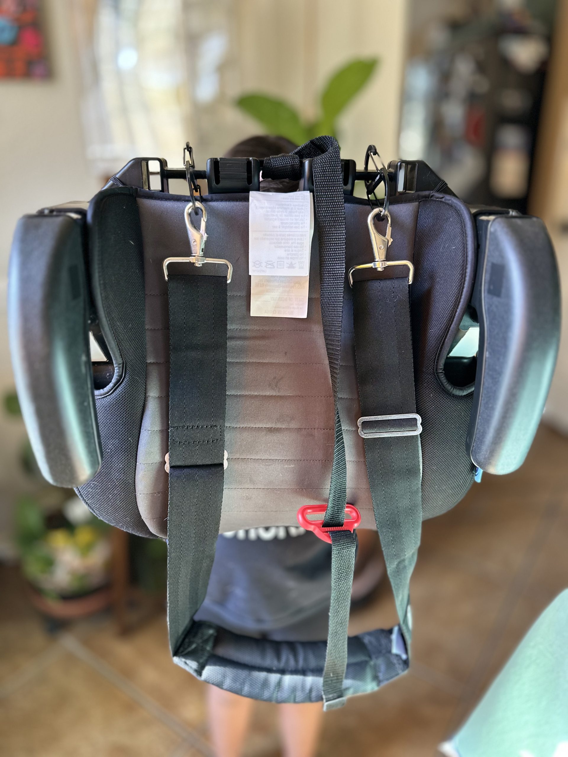 Airport hack: Booster seat shoulder strap